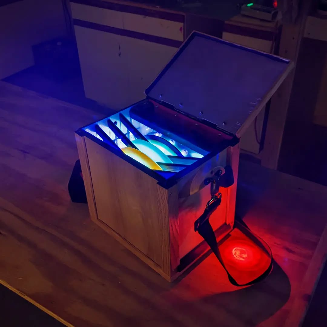 I know it's not a dyed disc, but it holds 'em! I made this box to charge up my discs while I play glow rounds this winte