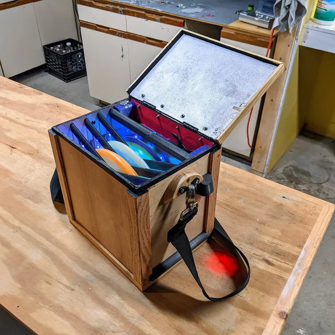 I know it's not a dyed disc, but it holds 'em! I made this box to charge up my discs while I play glow rounds this winte